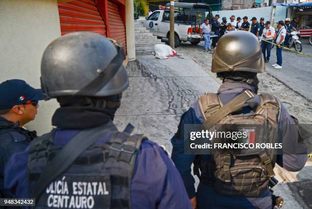 Graphic content / Policemen arrive at the crime scene where a young man was gunned down by armed men in the neighborhood of La Cima in the convulsive...