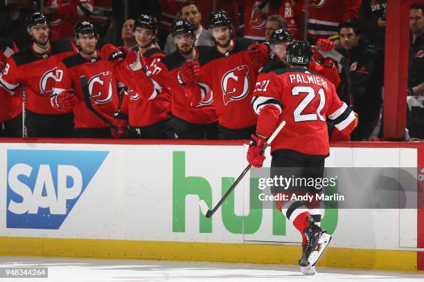 Kyle Palmieri of the New Jersey Devils celebrates his first period power play goal against the Tampa Bay Lightning in Game Four of the Eastern...