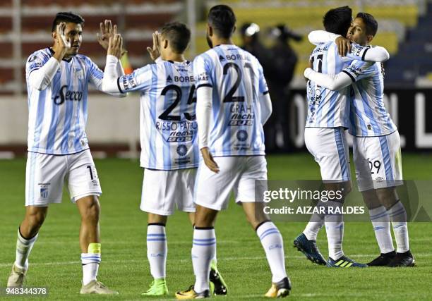 Argentina's Atletico Tucuman footballers celebrate after scoring against Bolivia's The Strongest, during their Copa Libertadores football match at...