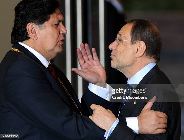 Alan Garcia, Peru's president, left, speaks with Javier Solana, secretary general of the European Commission, during the Fifth Summit of Latin...
