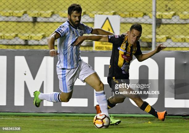 Bolivia's The Strongest player Henry Vaca vies for the ball with Argentina's Atletico Tucuman Nicolas Romat, during the Copa Libertadores football...