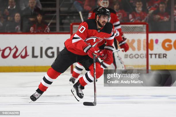 Marcus Johansson of the New Jersey Devils pursues the puck in Game Four of the Eastern Conference First Round against the Tampa Bay Lightning during...