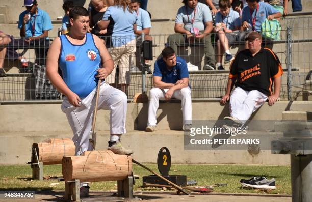 This photo taken on March 25, 2018 shows 18-year-old Curtis Bennett preparing to take part in a woodchopping competition at the Easter Show in...