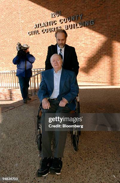 John McDarby, in wheelchair, and his attorney Jerry Kristal, arrive at the Atlantic County Civil Courts Building in Atlantic City, New Jersey Monday,...