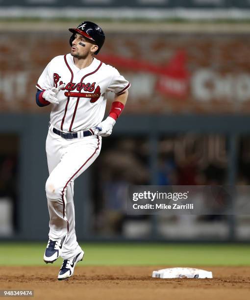 Third baseman Ryan Flaherty of the Atlanta Braves runs past second base after hitting a 3-run home run in the fifth inning during the game against...