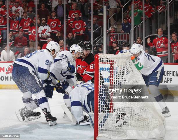 Marcus Johansson of the New Jersey Devils is stopped during the second period against the Tampa Bay Lightning in Game Four of the Eastern Conference...