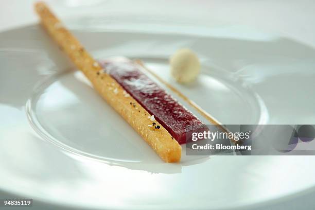 Dish of tuna sashimi served with a long, single French fry, is a play on the classic steak frites, at the restaurant Jade on 36, in Shanghai, China,...