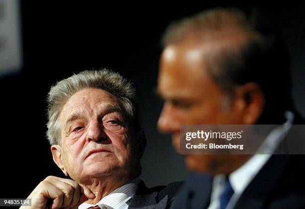 George Soros, left, the billionaire investor listens to Jose Angel Gurria a former Mexican finance minister at the European Bank for Reconstruction...