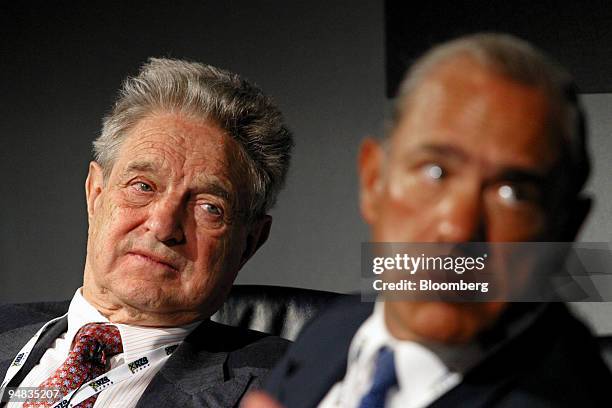 George Soros, left, the billionaire investor and Jose Angel Gurria a former Mexican finance minister listen at the European Bank for Reconstruction...