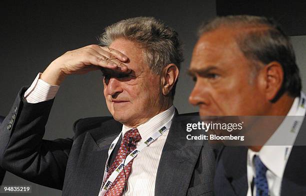 George Soros, left, the billionaire investor and Jose Angel Gurria a former Mexican finance minister listen at the European Bank for Reconstruction...
