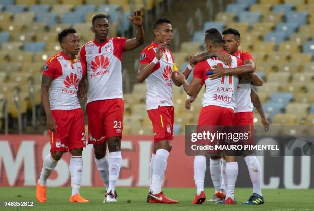 Colombia's Independiente Santa Fe player Wilson Morelo celebrates with his teammates after scoring a goal against Brazil's Flamengo during the 2018...