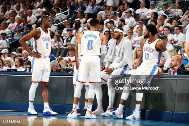 Jerami Grant Russell Westbrook Carmelo Anthony and Paul George of the Oklahoma City Thunder huddle in Game Two of Round One of the 2018 NBA Playoffs...