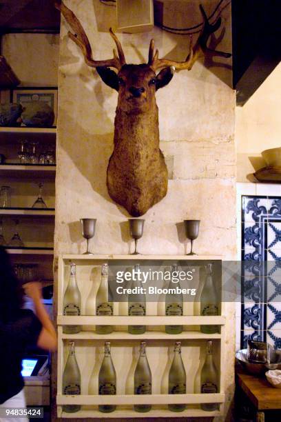 An stuffed animal bust hangs on the wall at Freemans, a restaurant located at the end of Freeman Alley off Rivington Street in New York, U.S., on...