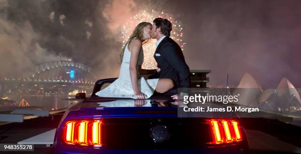 Couple share a first kiss inside a Ford Mustang convertible on January 01, 2015 in Sydney, Australia.