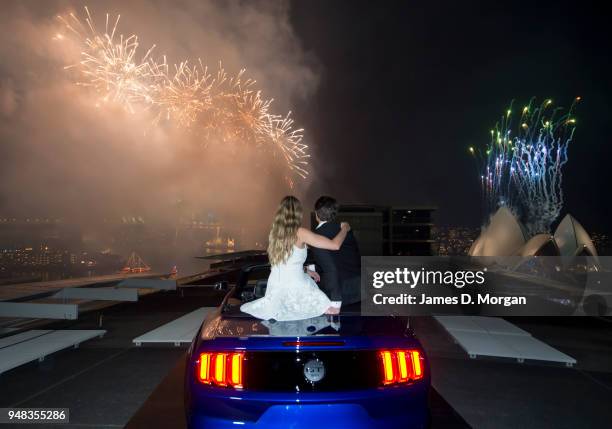 Couple share a first kiss inside a Ford Mustang convertible on January 01, 2015 in Sydney, Australia.