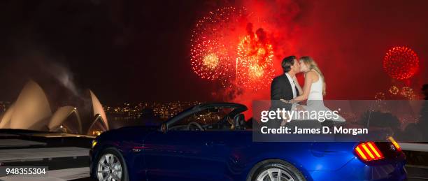 Couple share a first kiss inside a Ford Mustang convertible on January 01, 2015 in Sydney, Australia.