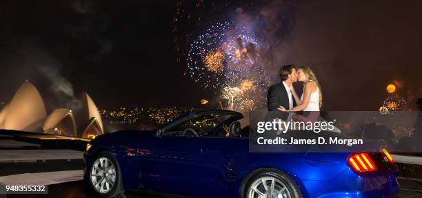 Couple share a first kiss inside a Ford Mustang convertible on January 01, 2015 in Sydney, Australia.