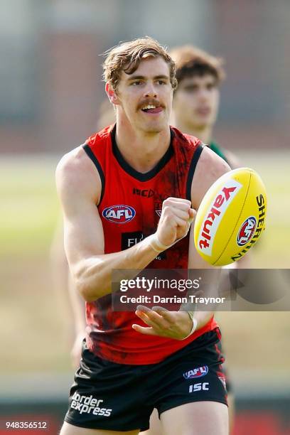 Joe Daniher of the Bombers handballs during an Essendon Bombers traing session on April 19, 2018 in Melbourne, Australia.