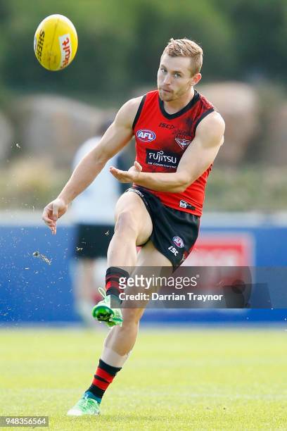 Devin Smith of the Bombers kicks the ball during an Essendon Bombers traing session on April 19, 2018 in Melbourne, Australia.