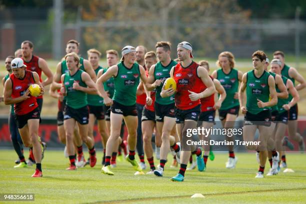 Essendon warm up during an Essendon Bombers traing session on April 19, 2018 in Melbourne, Australia.