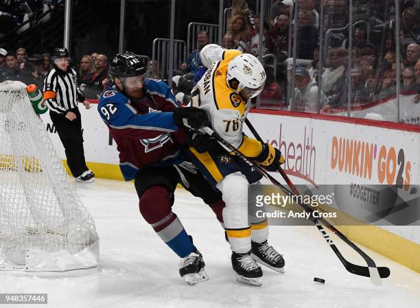 Colorado Avalanche left wing Gabriel Landeskog and Nashville Predators defenseman P.K. Subban go after the puck early in the period during the fourth...