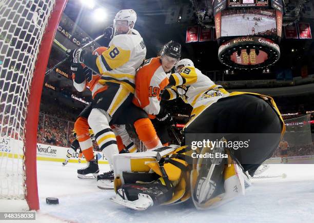 Nolan Patrick of the Philadelphia Flyers is unable to get the puck past Matt Murray and Brian Dumoulin of the Pittsburgh Penguins in the second...