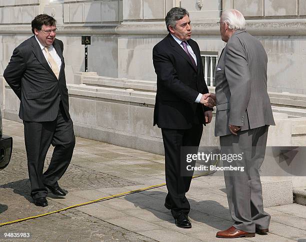 Ian Paisley, right, Northern Ireland's first minister, greets Gordon Brown, center, Britain's prime minister, and Brian Cowen, Ireland's new prime...