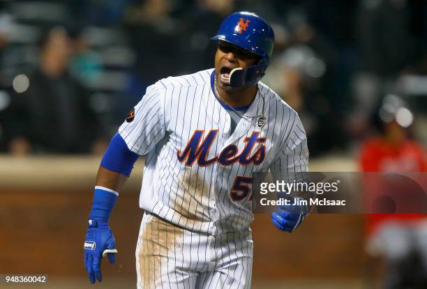 Yoenis Cespedes of the New York Mets reacts after his eighth inning grand slam home run against the Washington Nationals at Citi Field on April 18,...