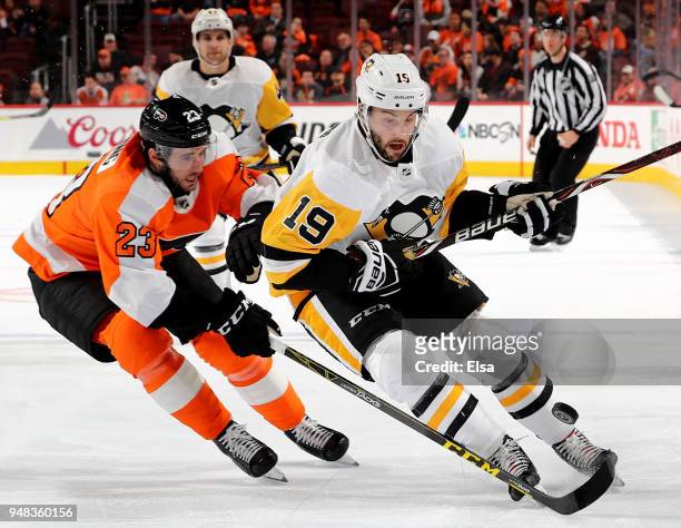 Derick Brassard of the Pittsburgh Penguins and Brandon Manning of the Philadelphia Flyers fight for the puck in Game Four of the Eastern Conference...
