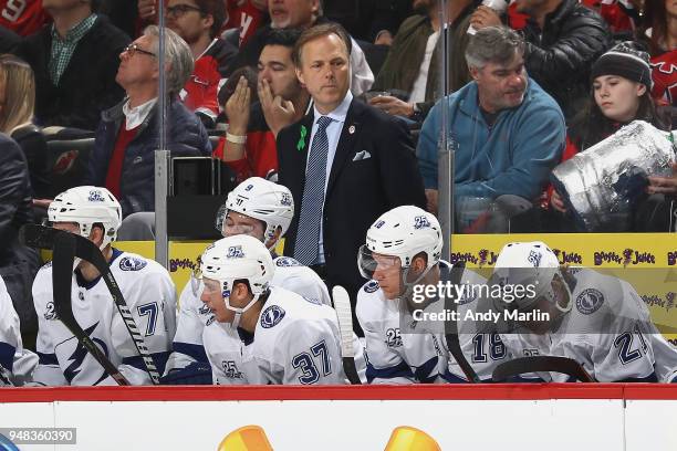 Head Coach Jon Cooper of the Tampa Bay Lightning looks on from the bench in Game Four of the Eastern Conference First Round against the New Jersey...