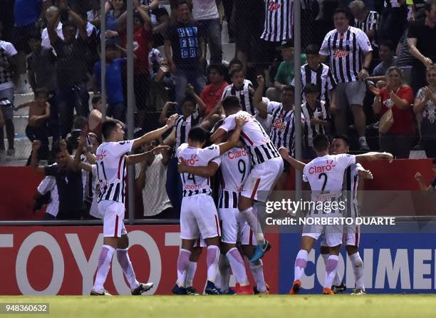 Players of Paraguay's Libertad celebrate after scoring against Uruguay's Penarol during their 2018 Libertadores Cup football match at the Nicolas...