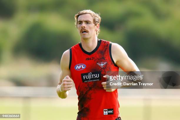 Joe Daniher of the Bombers jogs during an Essendon Bombers training session on April 19, 2018 in Melbourne, Australia.