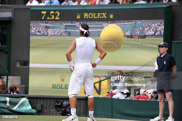 Rafael Nadal of Spain, the men's number two seed, watches the verdict of an appeal to Hawk-Eye, the high-speed multi-camera technology used to...