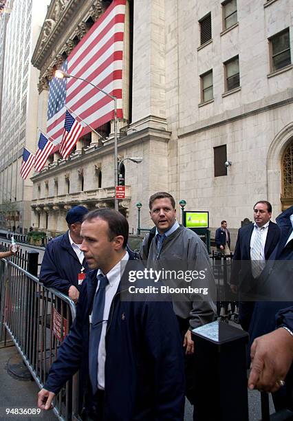 Traders leave the New York Stock Exchange after the closing bell in New York, U.S., on Thursday, Oct. 9, 2008. U.S. Stocks slid and the Dow Jones...