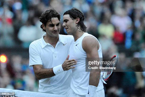 Roger Federer of Switzerland congratulates Rafael Nadal of Spain, right, after Nadal won the men's singles title at the Wimbledon tennis...