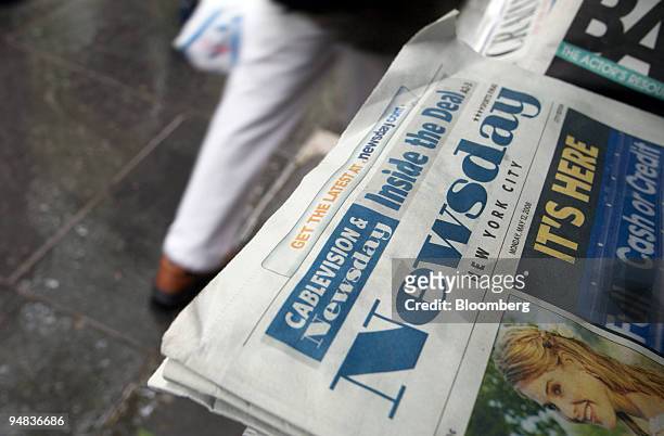 Newsday newspapers sit on display at a vendor in New York, U.S., on Monday, May 12, 2008. Cablevision Systems Corp., the New York-area cable...