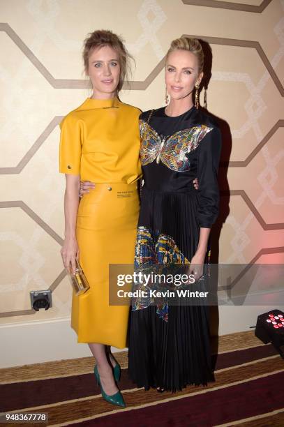 Mackenzie Davis and Charlize Theron attend the premiere of Focus Features' "Tully" at Regal LA Live Stadium 14 on April 18, 2018 in Los Angeles,...