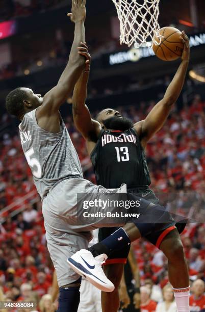 James Harden of the Houston Rockets drives past Gorgui Dieng of the Minnesota Timberwolves during Game Two of the first round of the Western...