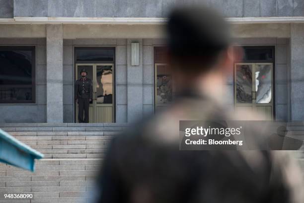 North Korean soldier stands guard outside the Panmungak building on the North Korean side of the truce village of Panmunjom in the Demilitarized Zone...