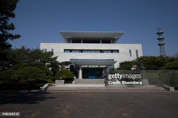 Man walks towards the Peace House building at the truce village of Panmunjom in the Demilitarized Zone in Paju, South Korea, on Wednesday, April 18,...