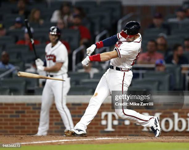 Third baseman Ryan Flaherty of the Atlanta Braves hits a broken bat, RBI single in the eighth inning during the game against the Philadelphia...