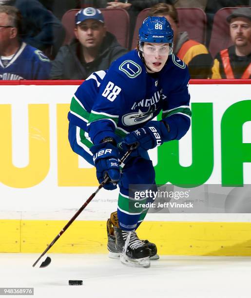 Adam Gaudette of the Vancouver Canucks skates up ice with the puck during their NHL game against the Edmonton Oilers at Rogers Arena March 29, 2018...