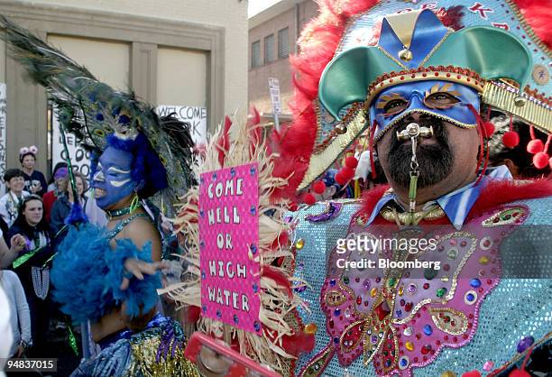 Members of the Krewe of Mondo Kayo Joe Perez, of Tampa Florida, right and Michelle Levine of New Orleans, parade down St.Charles Street in New...