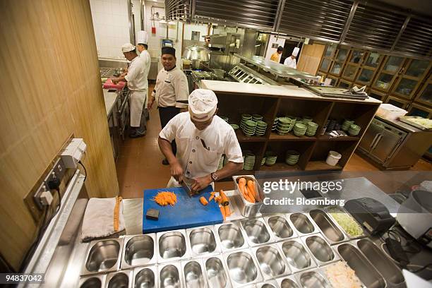 Cook works at the India Jones restaurant inside the Trident hotel prior to the official re-opening in Mumbai, India, on Saturday, Dec. 20, 2008. A...