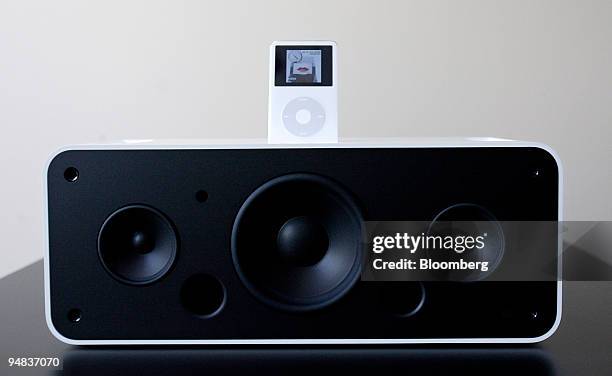 An iPod sits on top of the new iPod Hi-Fi stereo system, seen with it's front cover off, in Cupertino, California on Tuesday, February 28, 2006....