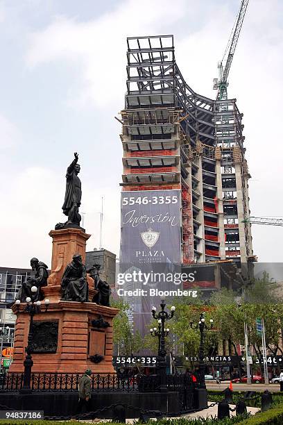 The Plaza Hotel sits under construction next to the Cristobal Colon monument along Paseo de la Reforma boulevard in Mexico City, Mexico, on Sunday,...