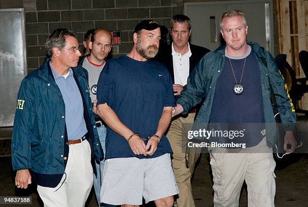 Samuel Israel lll, co-founder of the bankrupt hedge-fund company Bayou Group LLC, is escorted by U.S. Federal Bureau of Investigation and U.S....