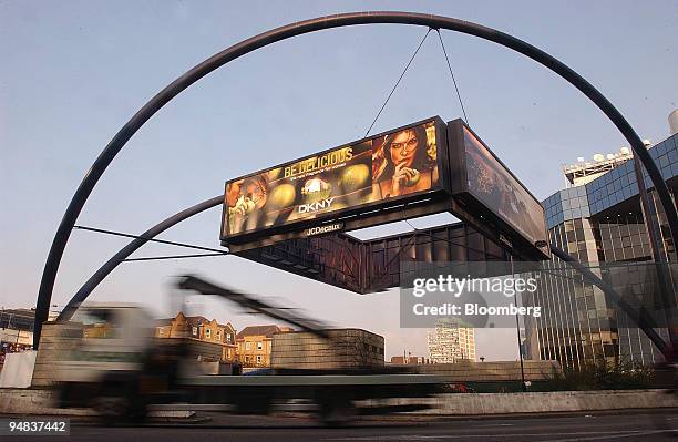 Traffic passes a JCDecaux advertising hoarding on a roundabout in London, Tuesday, February 8, 2005. JCDecaux SA, the world's second- largest outdoor...