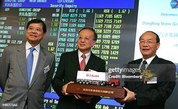 Anthony Lo Kai Yiu, left, member of the listing committee Hong Kong Stock Exchange, Lawrence Fok Kwong Man, center, head of Hong Kong Exchanges &...