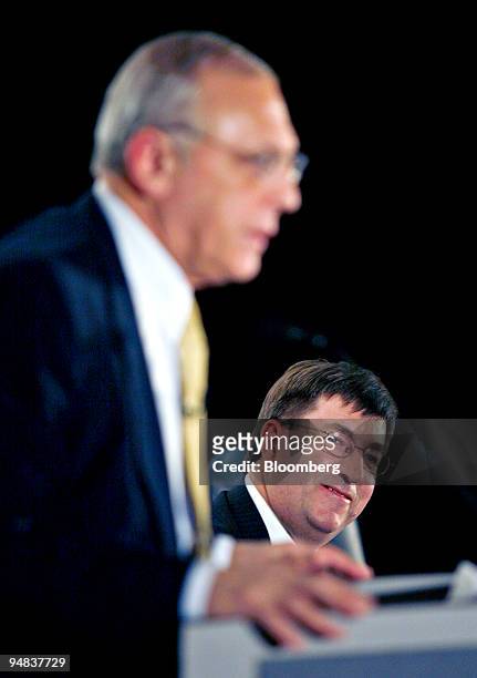 Michael Jesanis, president and COO of National Grid USA, right, looks on as Robert Catell, chief executive officer of KeySpan Corp., speaks during a...